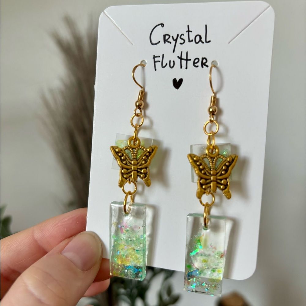 Crystal Flutter Earrings – Resin Dangle with Gold Butterfly Charm